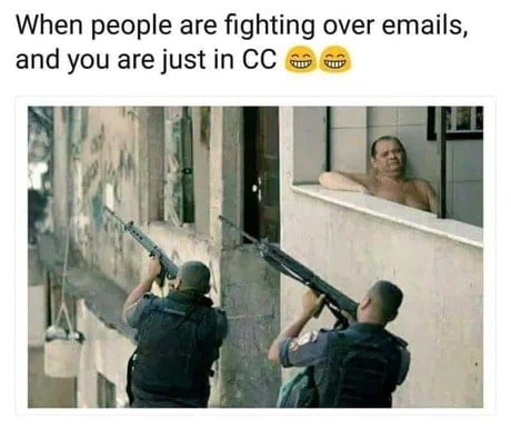 When people are fighting over emails and you are just in CC. Image of a man sitting on the balcony right next to 2 guys with guns